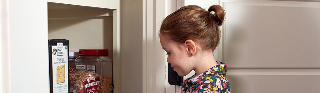 girl looking in pantry