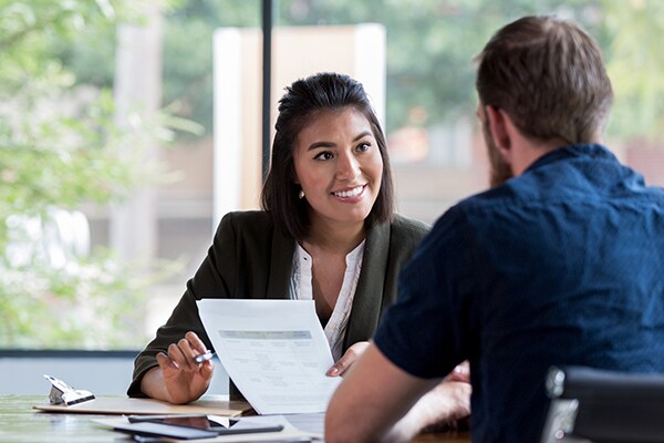 HR representative reviewing health insurance options with employee
