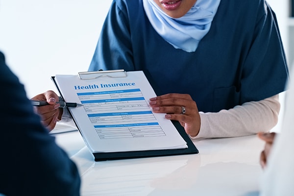 HR representative reviewing health insurance options with employee