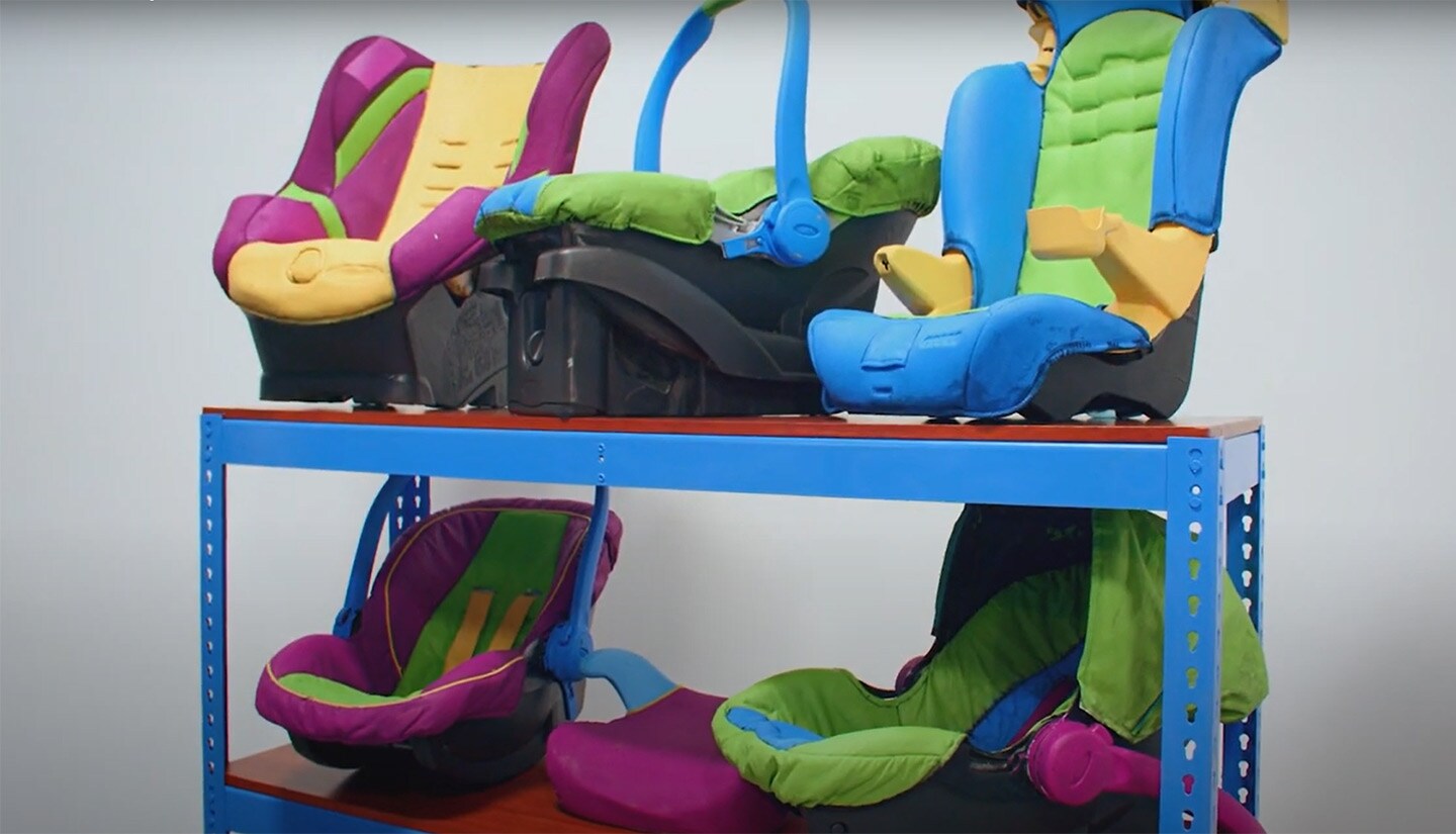 Colorful car seats sitting on shelves