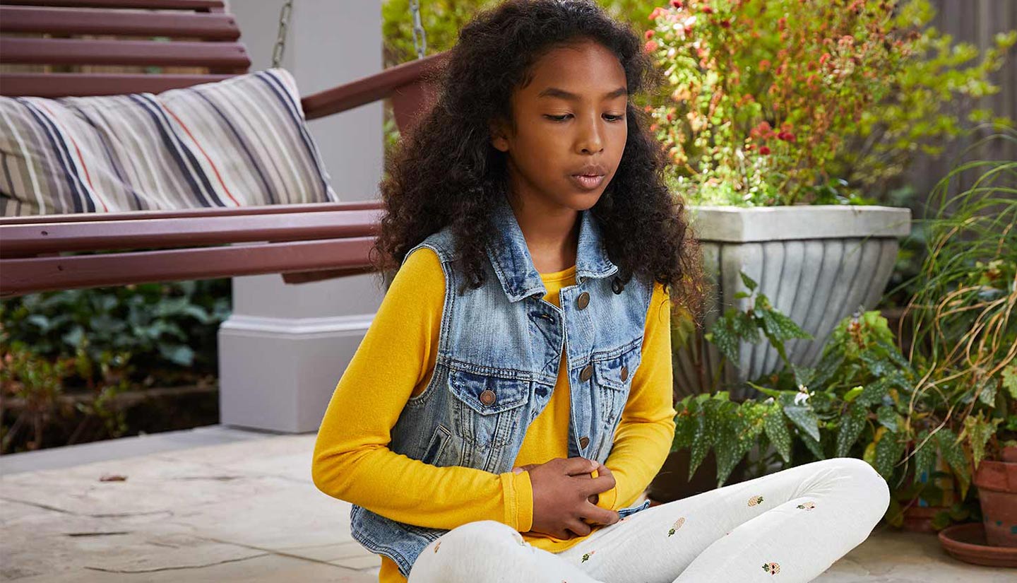 Girl practicing deep breathing