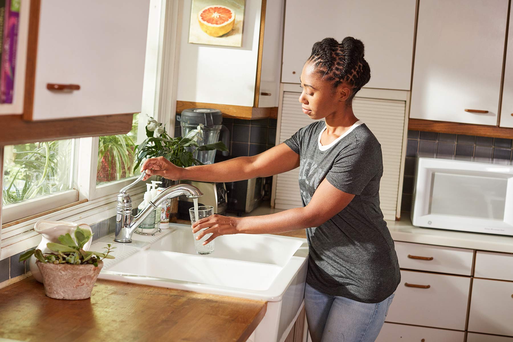 mom pouring glass of water