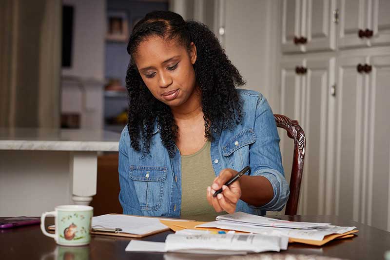 mom filling out paperwork
