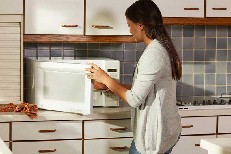 mom microwaving sweet potato