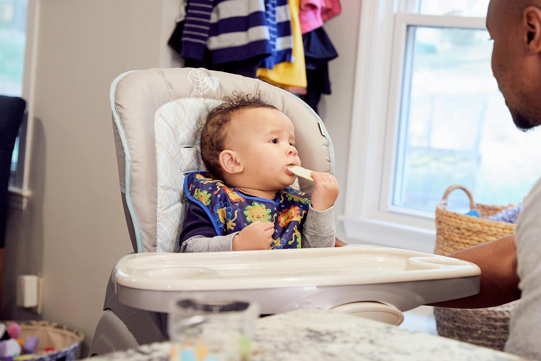 infant with teething biscuit