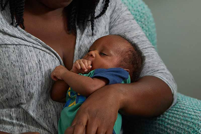 Baby with hand in mouth
