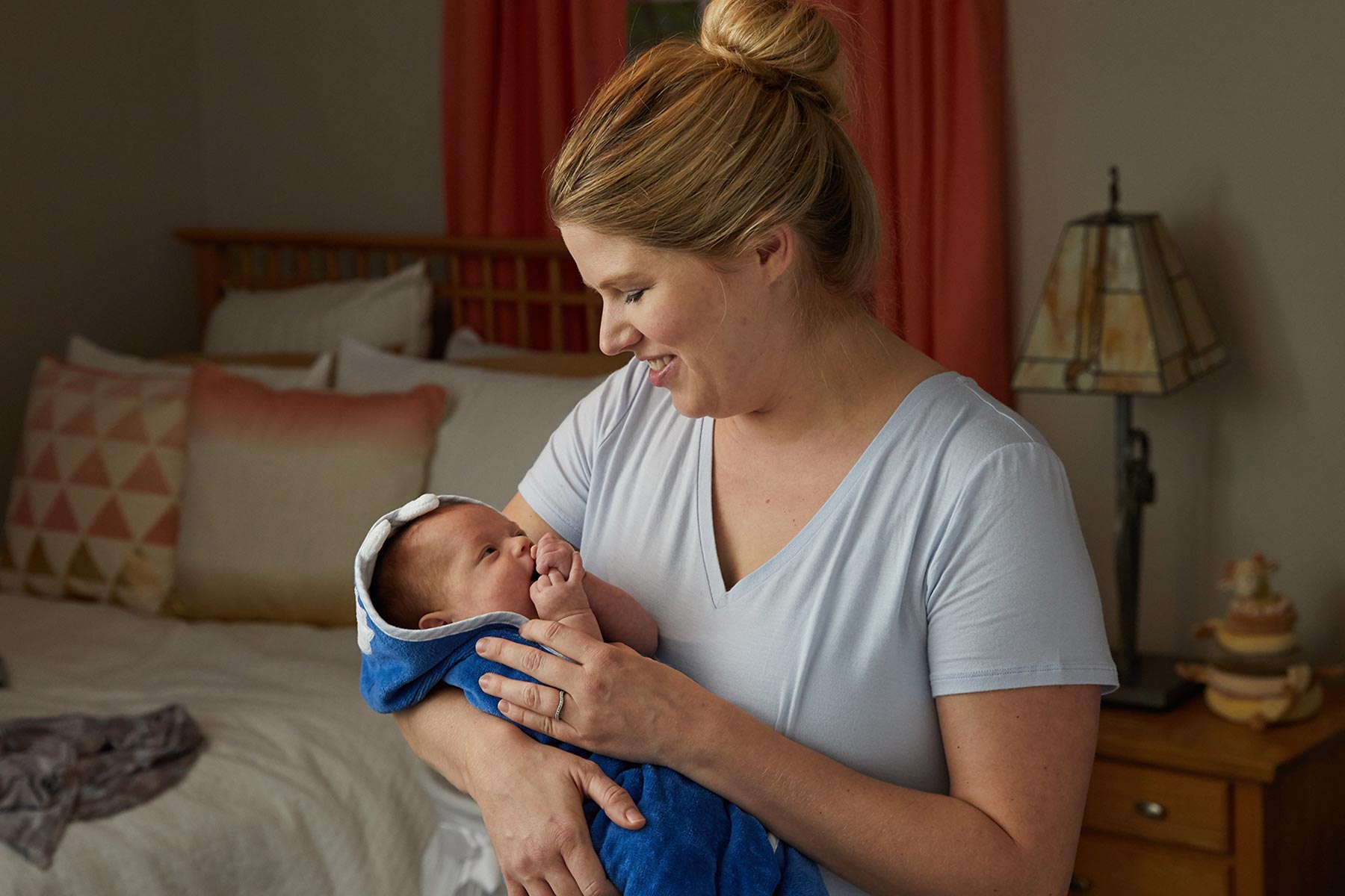 baby with wet hair wrapped up in towel