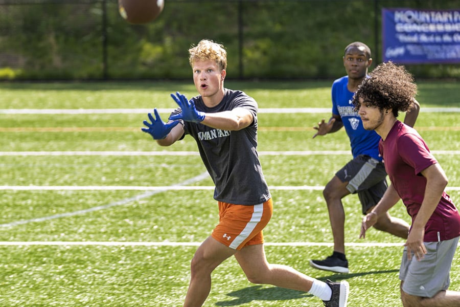 teen boys playing football