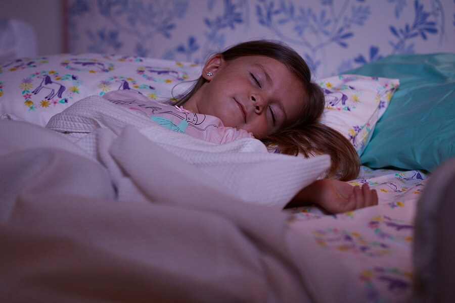 Girl asleep at bedtime