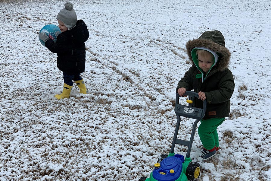 toddlers playing in the snow