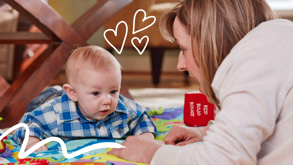 Photo shows mom and baby doing tummy time at 4 months