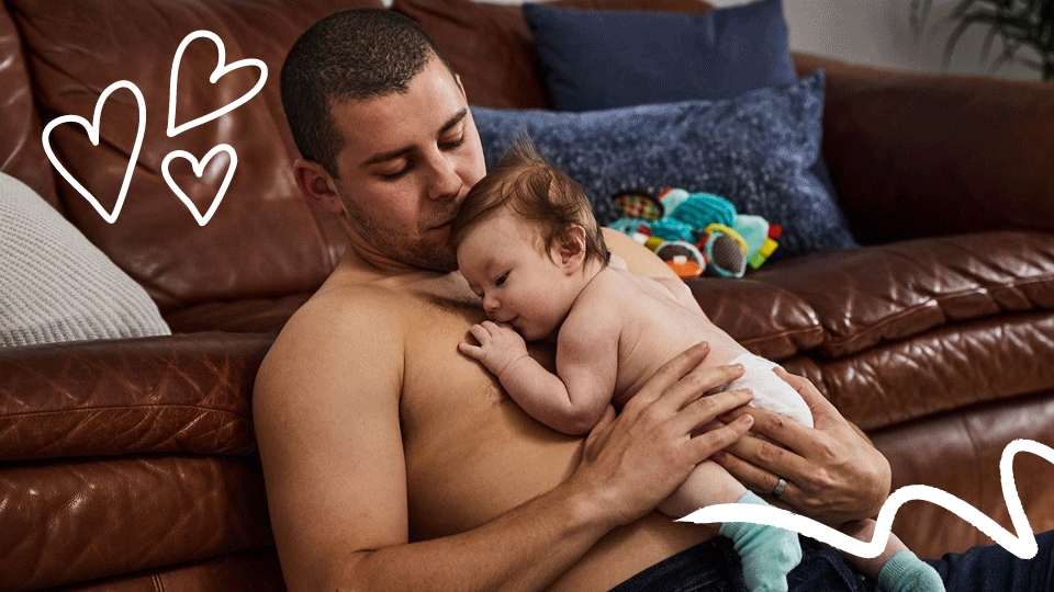 Dad does skin-to-skin contact with child for newborn tummy time