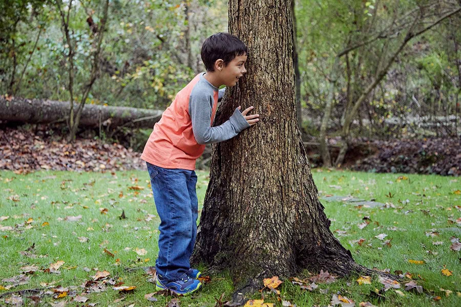 boy playing hide and seek