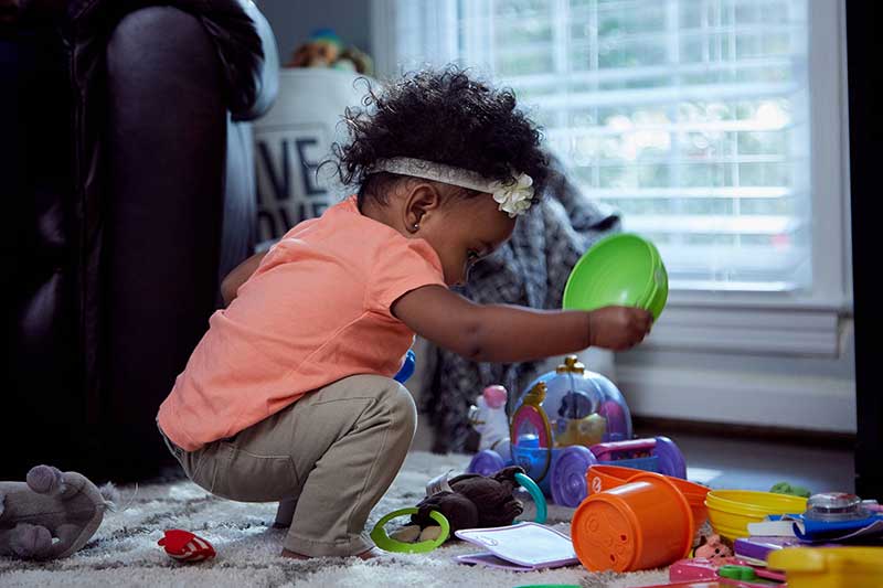 9 month old playing on floor