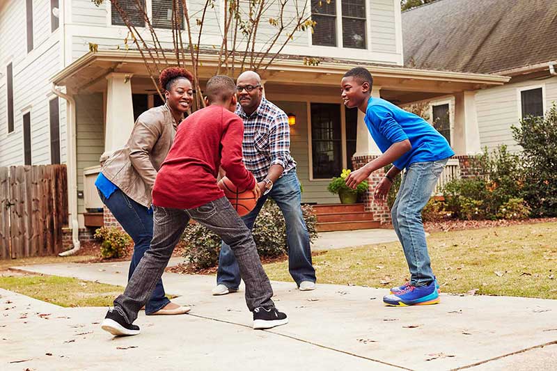 family playing basketball