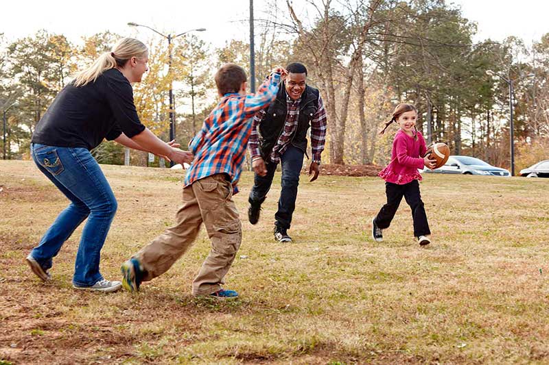 family playing football