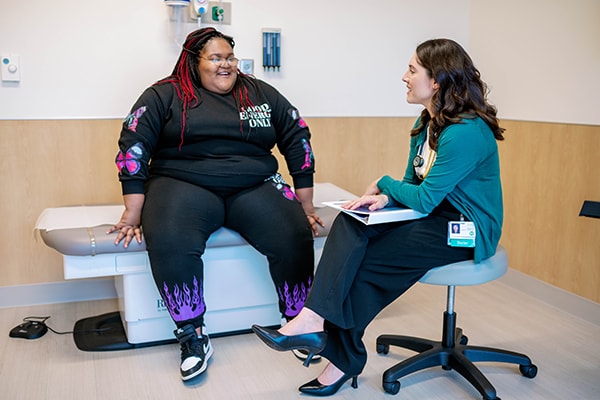 Strong4Life Clinic Medical Director Jessica Reilly, MD, counseling a patient