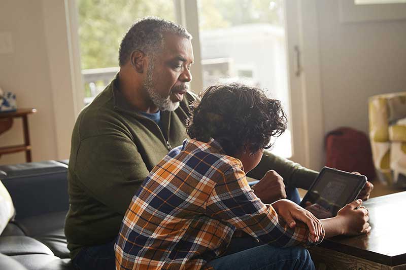 grandpa showing grandson how to find reputable sources online