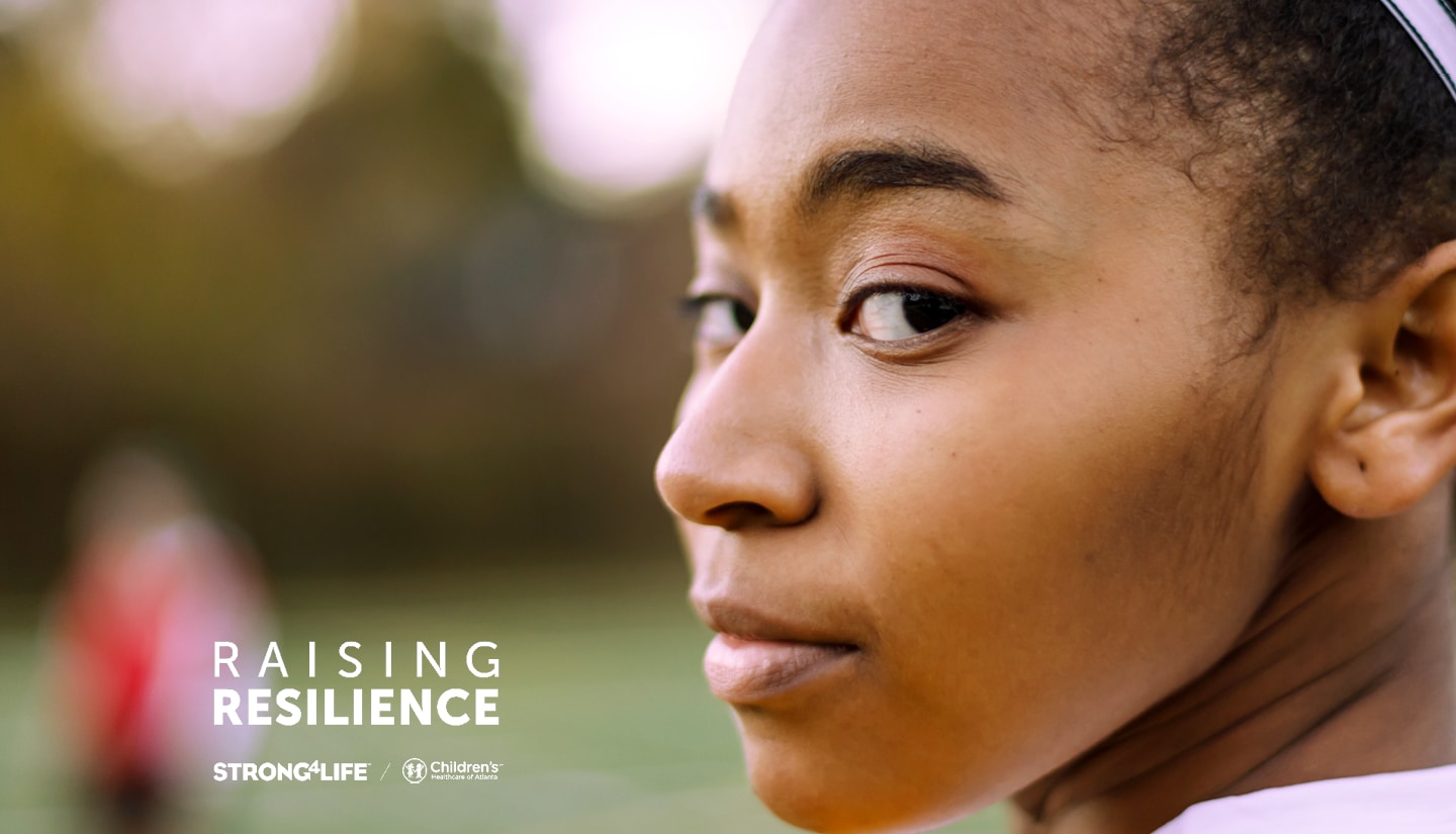 Teenage girl looks over her shoulder. Children's Healthcare of Atlanta Strong4Life Raising Resilience logo overlaid.