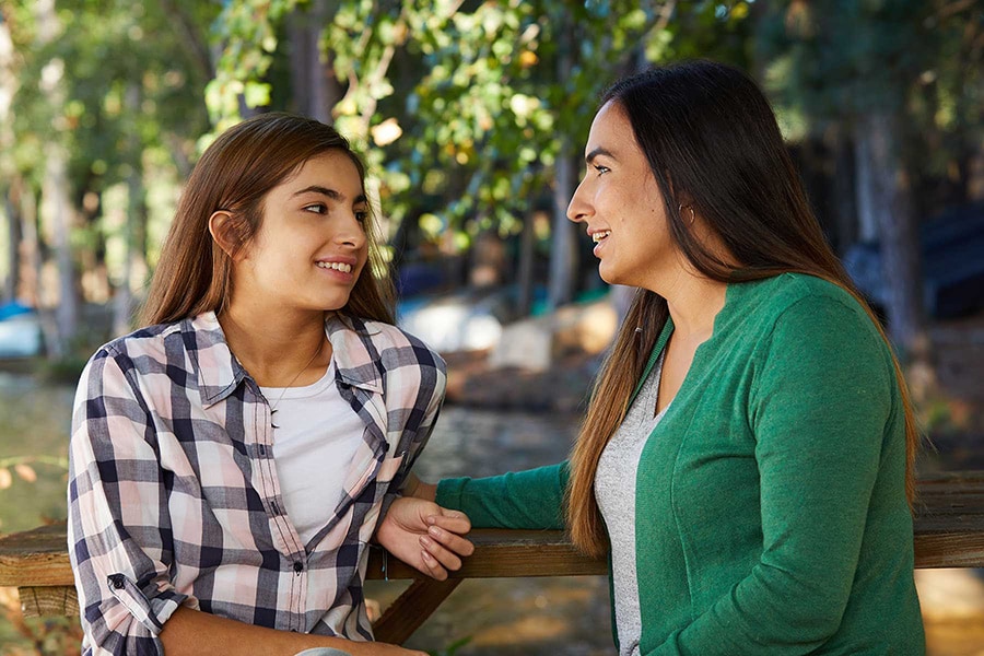mom and teen daughter talking
