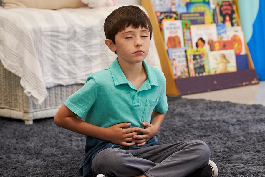 boy practicing deep breathing