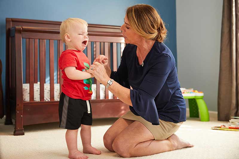 mom talking to son in his bedroom