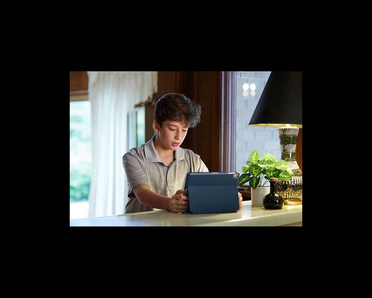 Child looking upset at computer