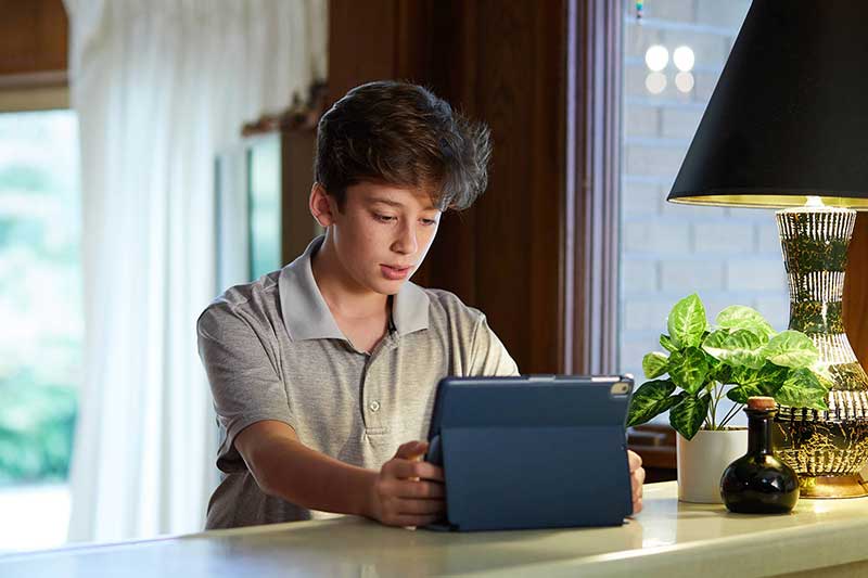 Child looking upset at computer