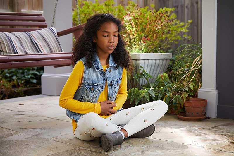 girl practicing deep breathing