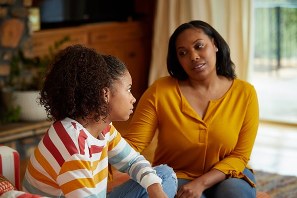 Mom helps teenage daughter talk through her emotions and how to handle them.