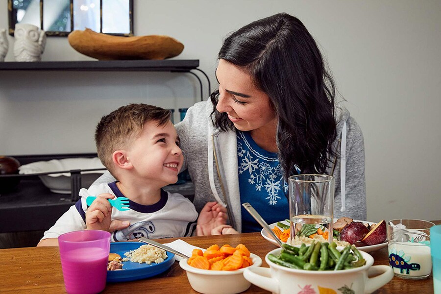 young boy smiling at mom