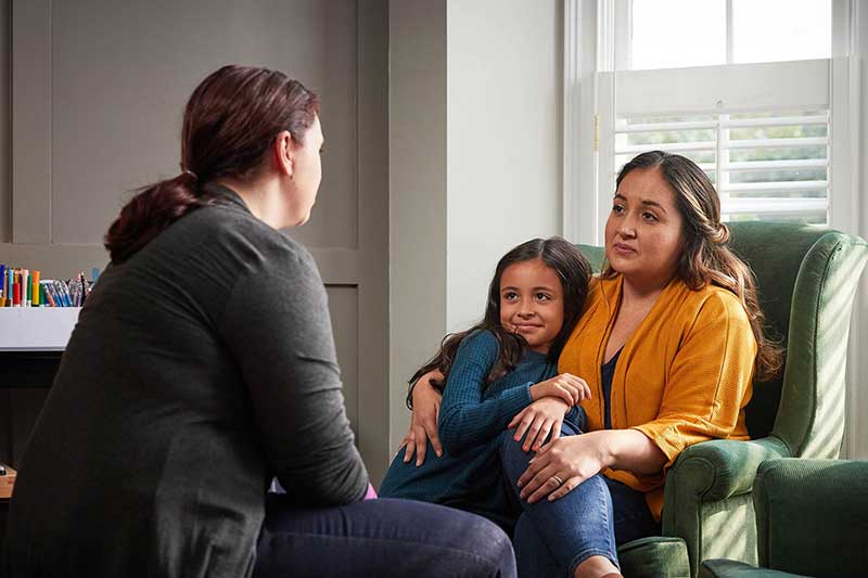 mom and daughter in therapist's office