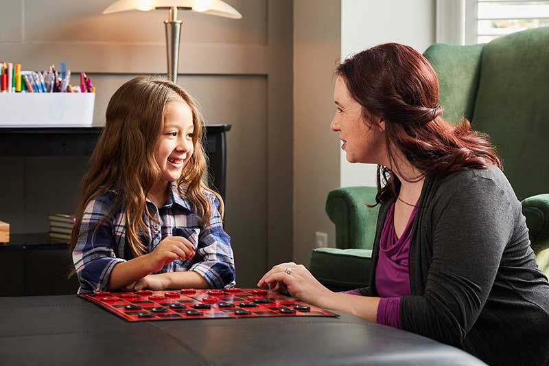 therapist interacting with young girl