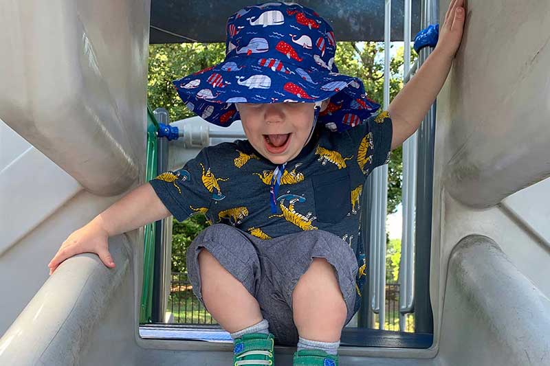 18 month old on park slide