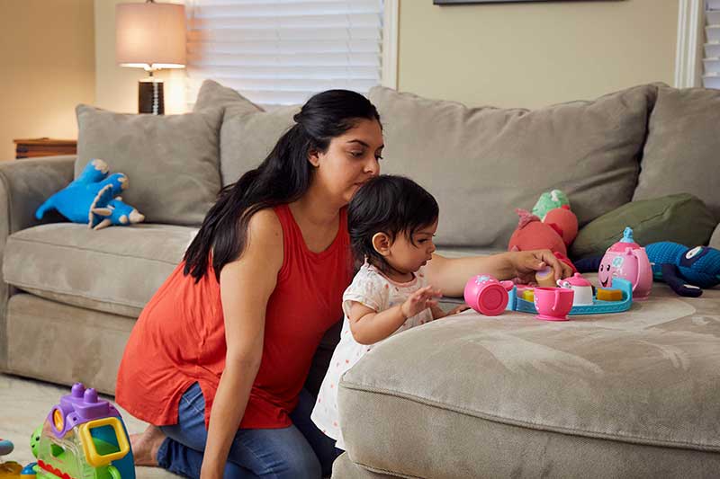 mom and 9 month old daughter playing