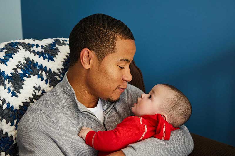 dad and infant son bonding