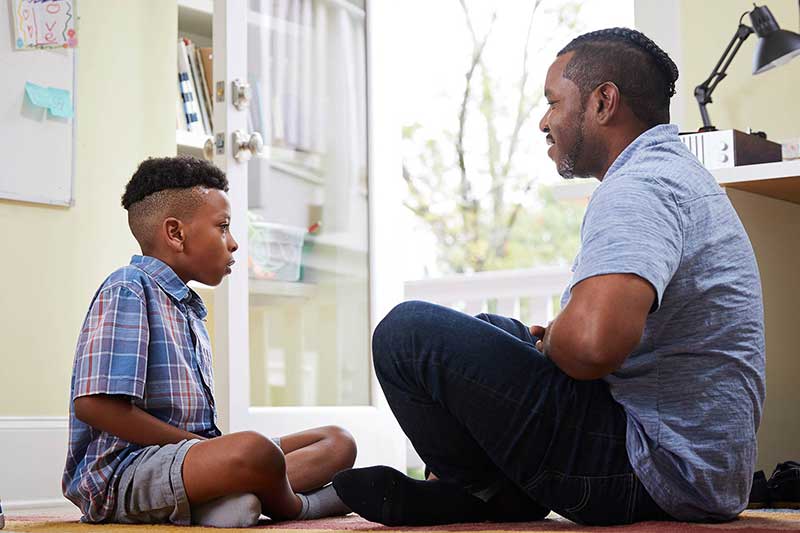 dad and son doing deep breathing exercises