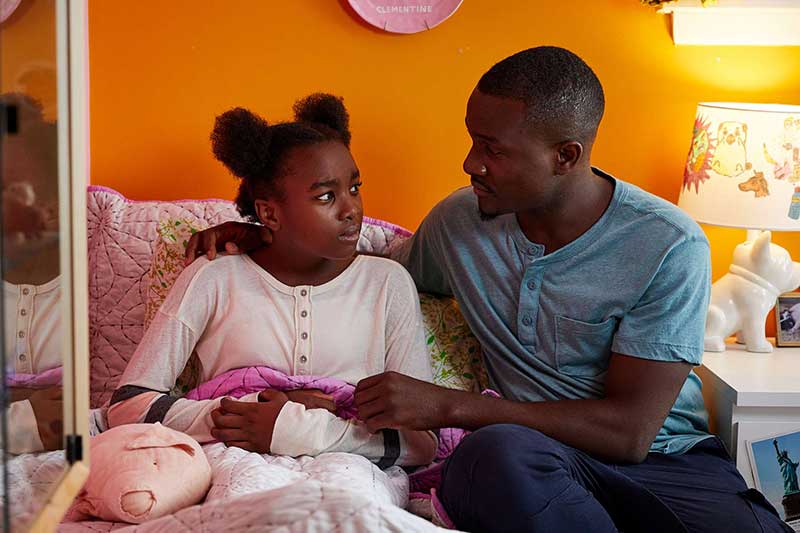 father consoling daughter in her bedroom