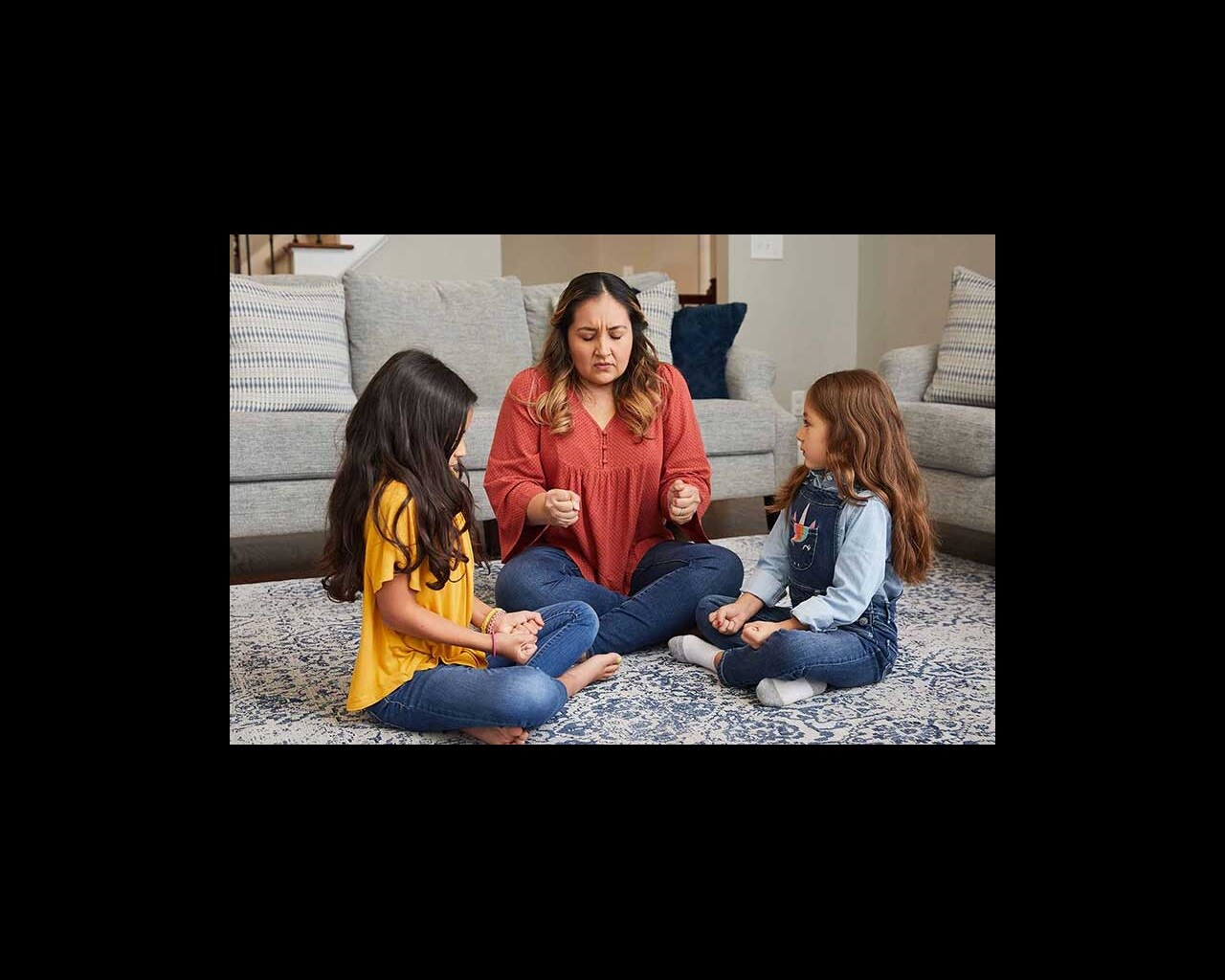 Parent practicing mindfulness exercises with children