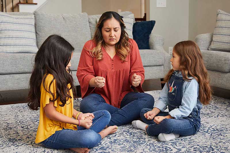 Parent practicing mindfulness exercises with children