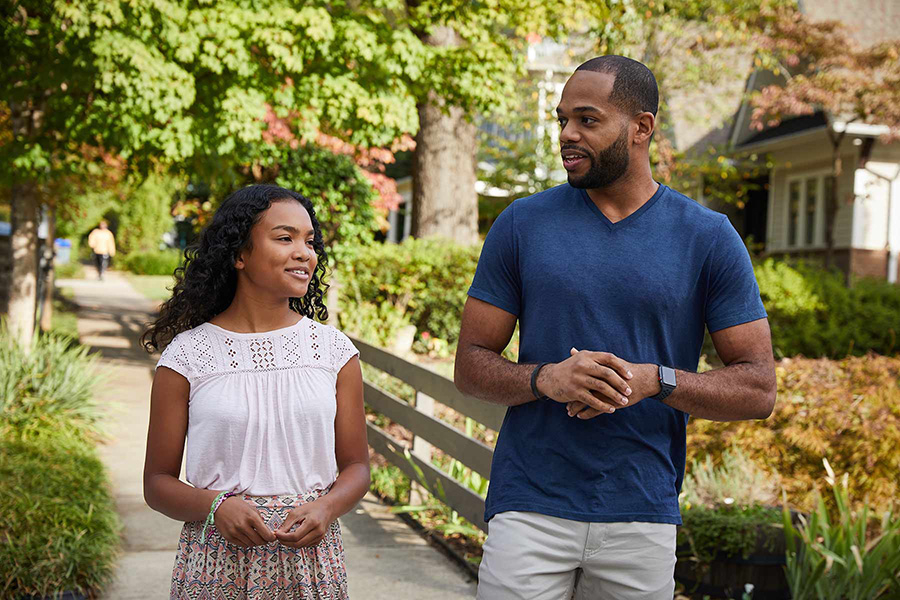 Father and daughter taking a walk outside 