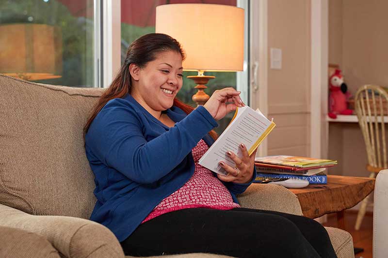 mom reading a book alone