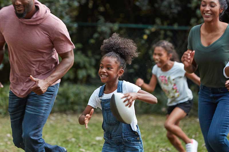 family playing football