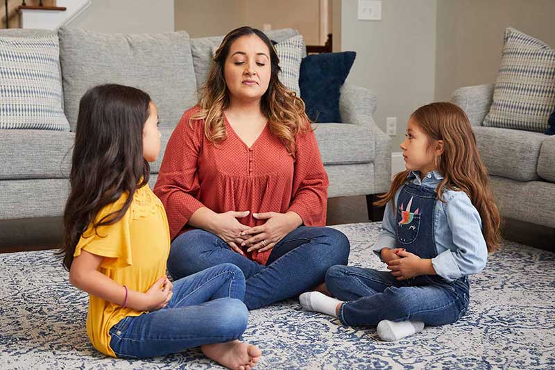 mom practicing coping skills with her daughters