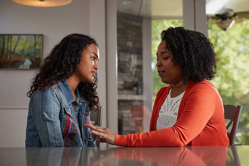 mom talking to daughter