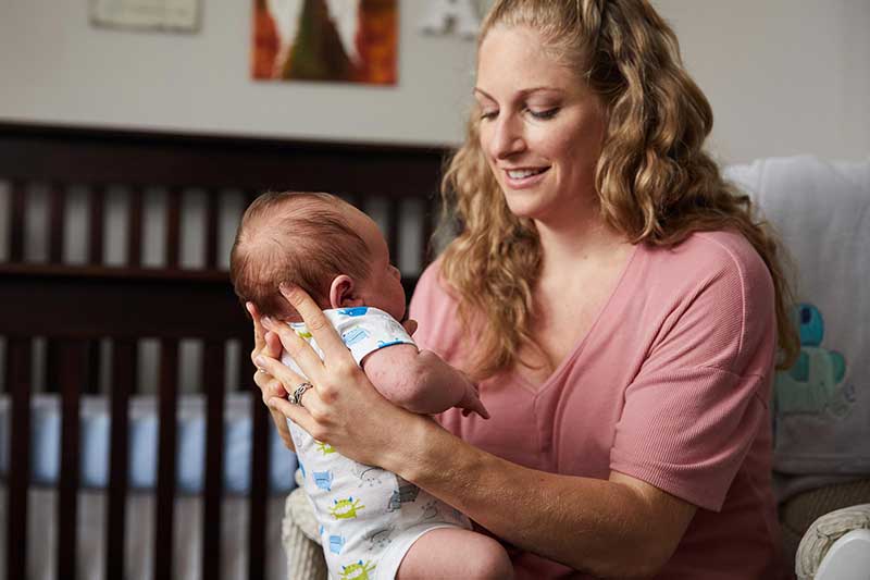 keeping newborn upright after feeding