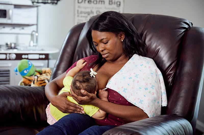 mom nursing using football hold