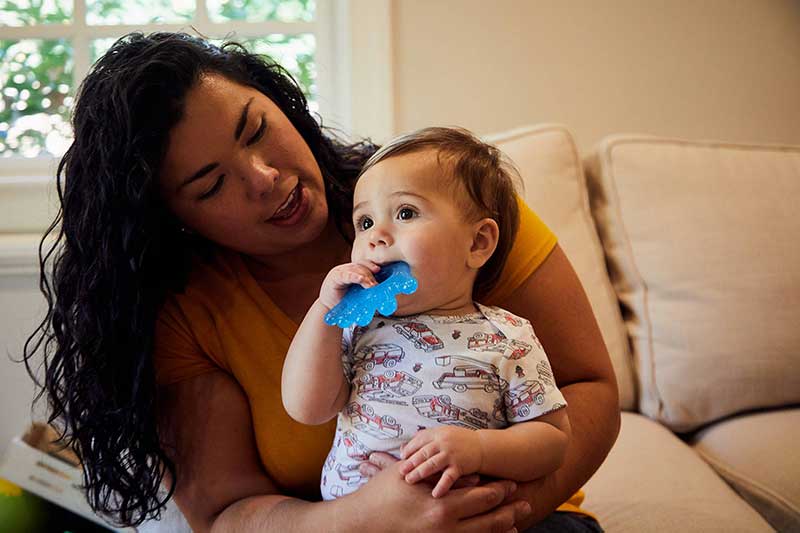 infant chewing on refridgerated teething ring