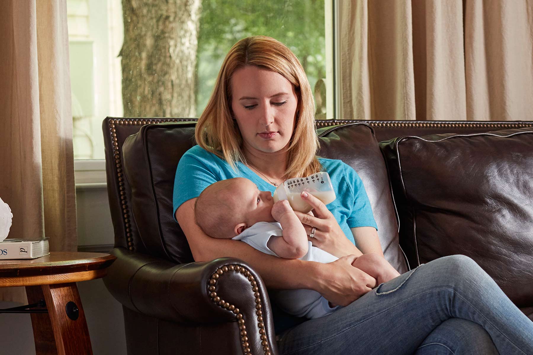 Mom feeding baby a bottle