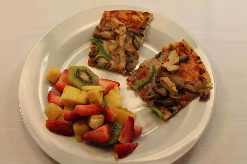 Pizza slices with fruit